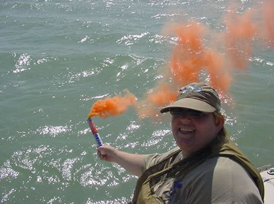 Kay holds a flare